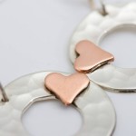 beaten silver disc earrings with gold hearts