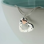 personalised hammered silver pendant with gold heart
