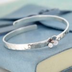 Personalised baby bangle with daisy