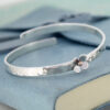 crossover bangle with daisy