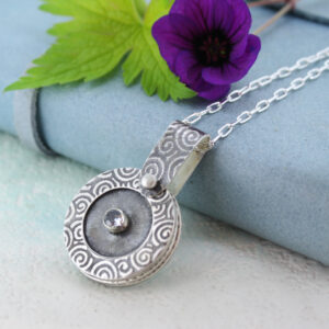 handmade textured silver photo locket with aquamarine