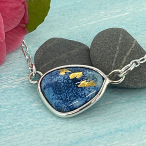 blue enamel necklace with gold highlights