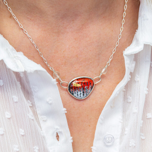 red enamel necklace with gold highlights