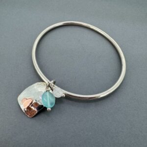 silver bangle with copper heart
